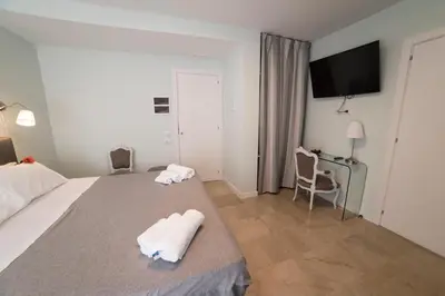 a hotel room with a bed with towels on it at B&B Attico 33 in Palermo