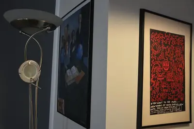 a lamp in a room with a picture on the wall at Luci della città Palazzo San Matteo in Palermo