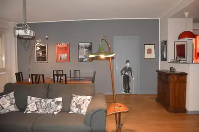 a living room with a couch and a floor lamp at Luci della città Palazzo San Matteo in Palermo