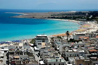 a view of a beach with a group of buildings at Sicilia Vacation in San Vito lo Capo