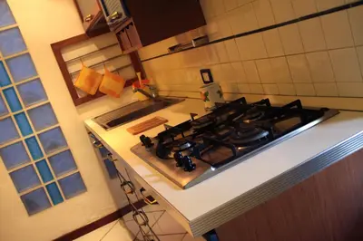 a kitchen with a stove top in a kitchen at A un passo dal mare in Lido di Mondello