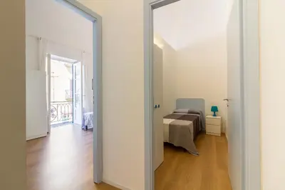 a door leading into a bedroom with a bed at Casa Turano in Castellammare del Golfo