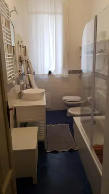 a bathroom with two sinks and a toilet at Duchi in Palermo