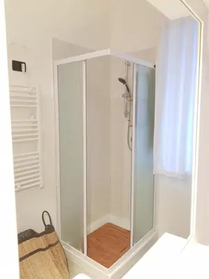 a shower with a glass door in a bathroom at Duchi in Palermo