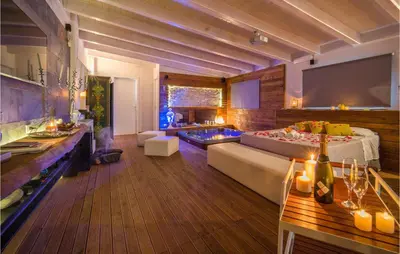 a large living room with a bed and a tub at Palermo Per Due in Torretta