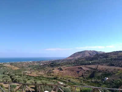 a view of the ocean from the top of a hill at Agriturismo le Campanelle - Sicilia - Cefalù in Lascari