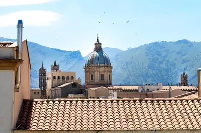a view of a city with mountains in the background at Capo House in Palermo