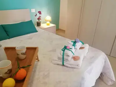 a room with a bed with towels on it at Casa Vacanze Aurora in Balestrate