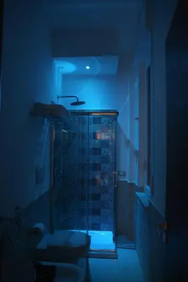 a bathroom with a shower with a toilet and a sink at Le Cupole Decò in Palermo
