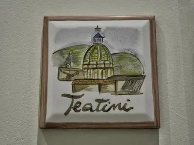 a picture of a bird cage hanging on a wall at Le Cupole Decò in Palermo