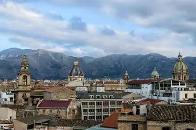 a view of a city with mountains in the background at Le Cupole Decò in Palermo