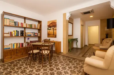 a living room with a table and chairs at Matilde Boutique Hotel by AR Group Hotels in Isola delle Femmine