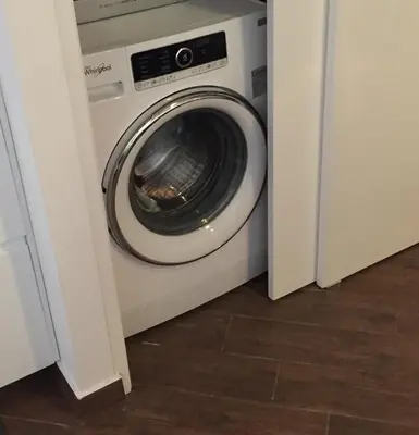 a washer and dryer sitting in a room at Uloft Apartment Palermo in Palermo