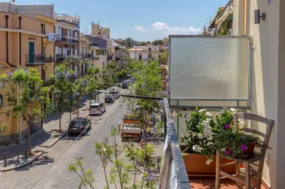 a view of a street from a balcony at Casa Colibrì - Solemar Sicilia in Santa Flavia