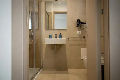 a bathroom with a sink and a mirror at B&B Vista Mare in San Vito lo Capo