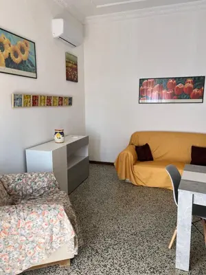 a living room with a couch and a table at Holiday mondello in Mondello