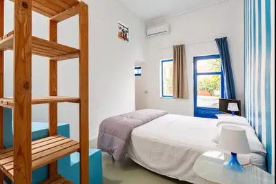 a bedroom with a bunk bed and a ladder at Charming loft con Terrazze al Teatro Massimo in Palermo