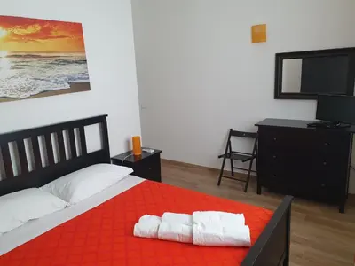 a bedroom with a bed with two towels on it at Villa Limone in Castellammare del Golfo
