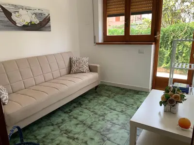 a living room with a couch and a table at Casa Vacanze Astori in Trabia