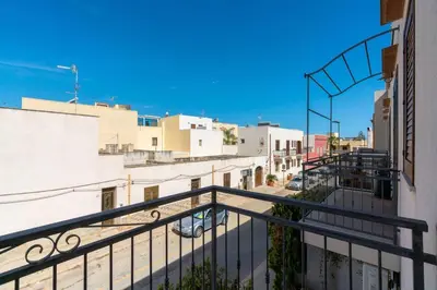 a view of a city street from a balcony at Casa Irene in San Vito lo Capo