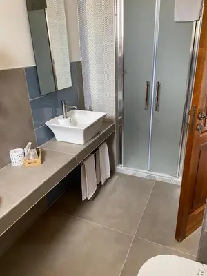 a bathroom with a sink and a shower at Tenute Plaia Agriturismo in Scopello