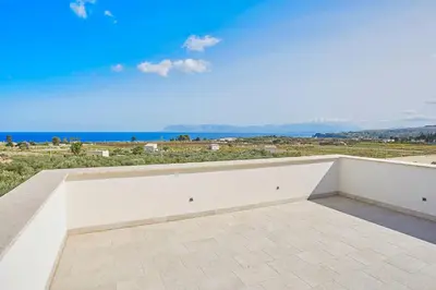 a balcony with a view of the ocean at Villa dell'Artista in Scopello