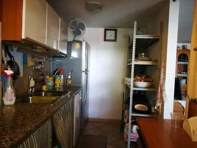 a kitchen with a sink and a refrigerator at Villa Caterina in Mondello
