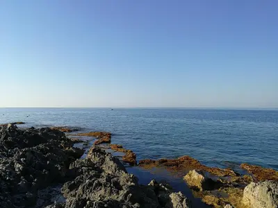 a view of the ocean from a rocky shore at Villa Caterina in Mondello