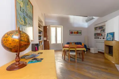 a living room with a table with a globe on it at Terrazze di San Francesco by Wonderful Italy in Palermo