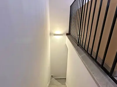 a stairway with a light on the side of a building at Appartamenti-Residence Al Massimo in Palermo
