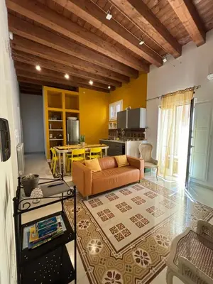 a living room with a couch and a table at Casa di Cocò in Palermo