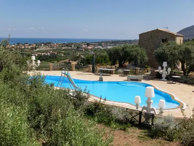 a swimming pool with a slide and a playground at Terrazze sul Tirreno in Lascari