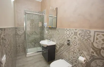 a bathroom with a sink and a shower at B&B Palermo Sole & Cultura in Palermo