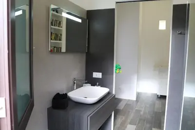 a bathroom with a white sink on a counter at Azzurra Tresor in Scopello
