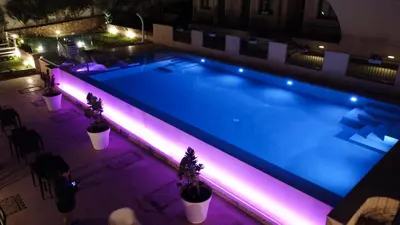 an overhead view of a swimming pool at night at Hotel Baglio Di Scopello in Scopello