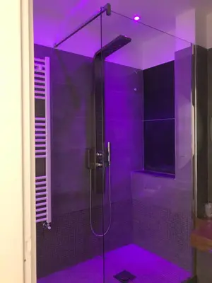 a shower with purple lighting in a bathroom at Porta Maqueda in Palermo