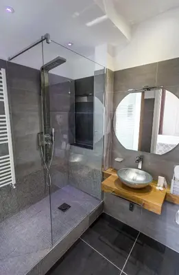 a bathroom with a sink and a shower at Porta Maqueda in Palermo