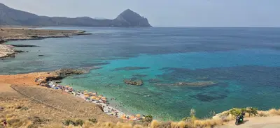an aerial view of a beach with people in the water at Al Civico 365 in Castelluzzo