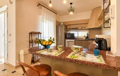 a kitchen with a counter with fruit on it at Villa Delle Sterlizie in Valguarnera