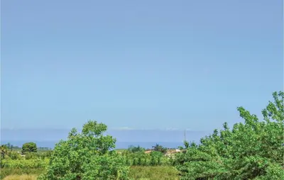 a group of trees with the sky in the background at Villa Delle Sterlizie in Valguarnera