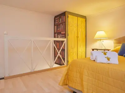 a bedroom with a bed and a sliding door at Dimora dei Leoni in Palermo