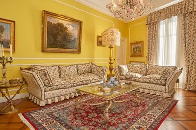 a living room with two couches and a table at Dimora dei Leoni in Palermo
