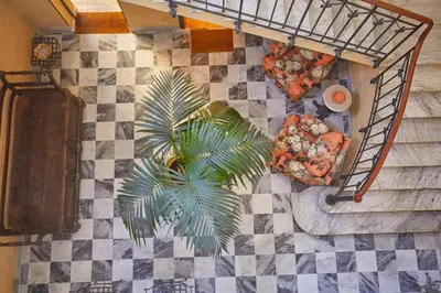an overhead view of a room with furniture and a palm tree at Dimora dei Leoni in Palermo