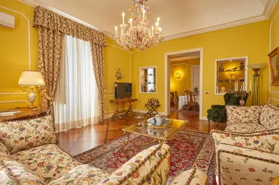 a living room with a couch and a table at Dimora dei Leoni in Palermo