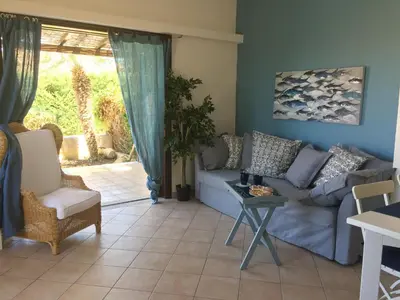a living room with a couch and a table at Blu Marea in Macari