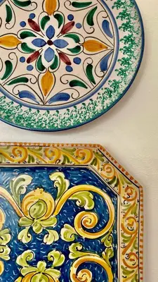 two plates and a plate on a wall at Casa di Cri in San Vito lo Capo