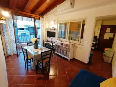 a kitchen and dining room with a table and chairs at casa Barone in Balestrate