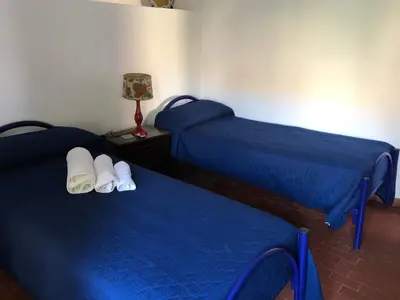 a small kitchen with a stove and a refrigerator at Villino Fraginesi in Castellammare del Golfo