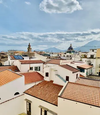 a view of roofs of buildings in a city at La Maison del Sole in Palermo