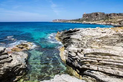 a view of the ocean from a rocky cliff at Case vacanza Cristina site in Antico Baglio e in via Abruzzi n 161 in San Vito lo Capo